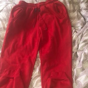 Brand new red joggers size large